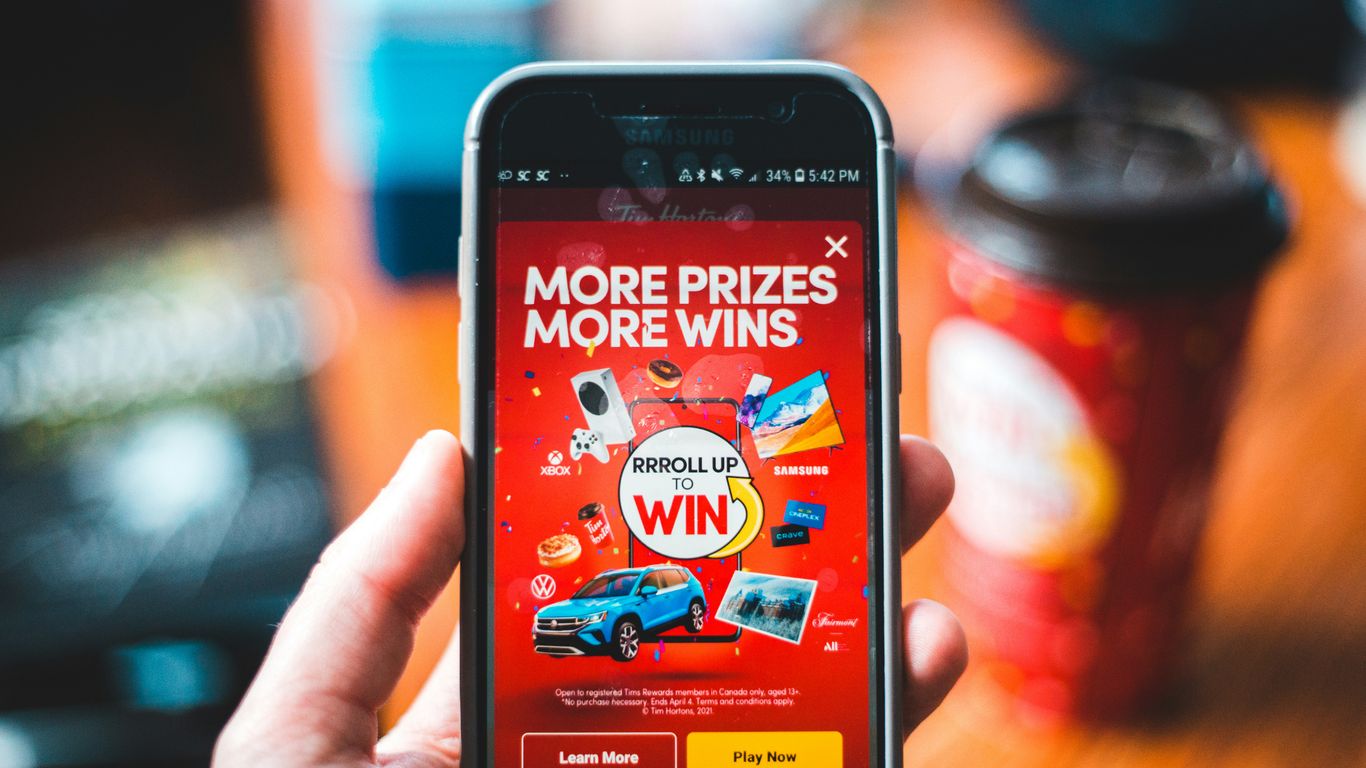 red and black smartphone showing game application