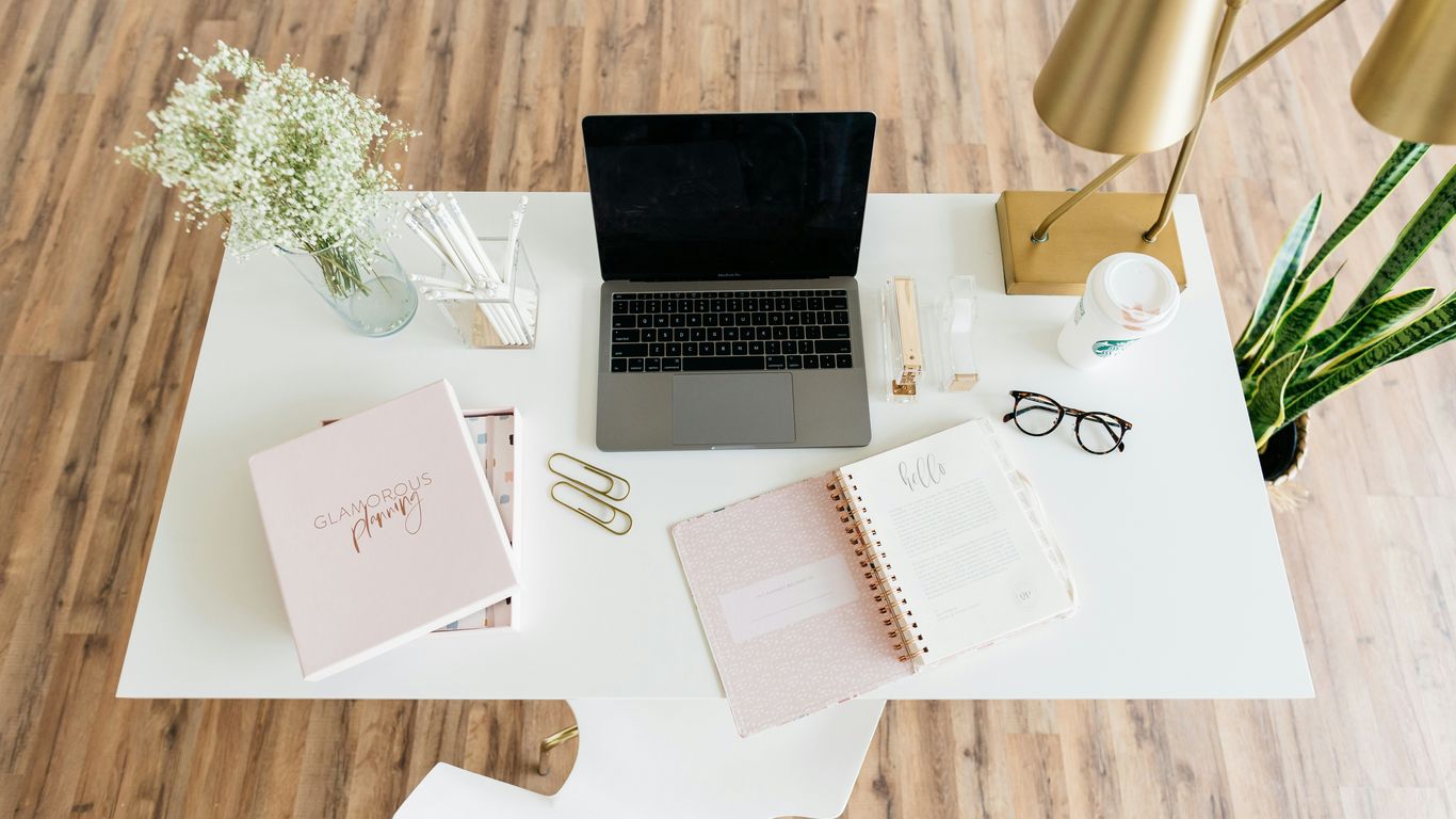 A clean desk setup with a modern ball chair