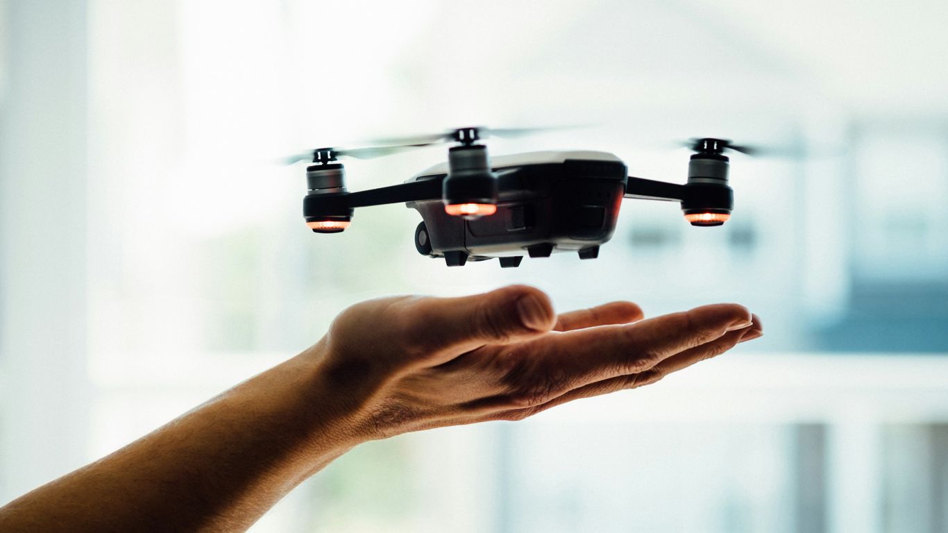 turned on black quadcopter drone