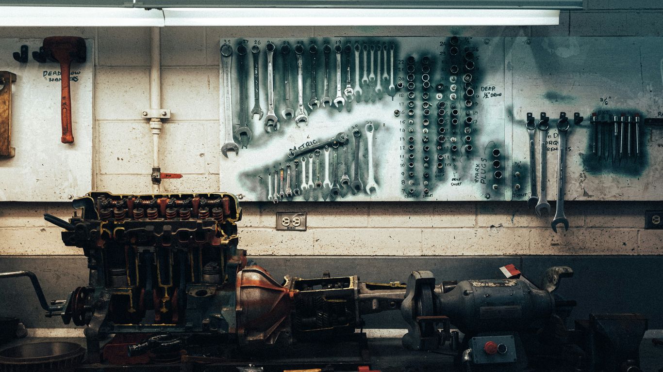 a bunch of tools hanging on a wall