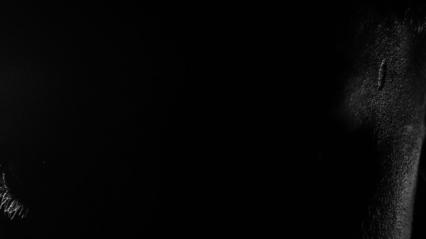 a black and white photo of a man's face