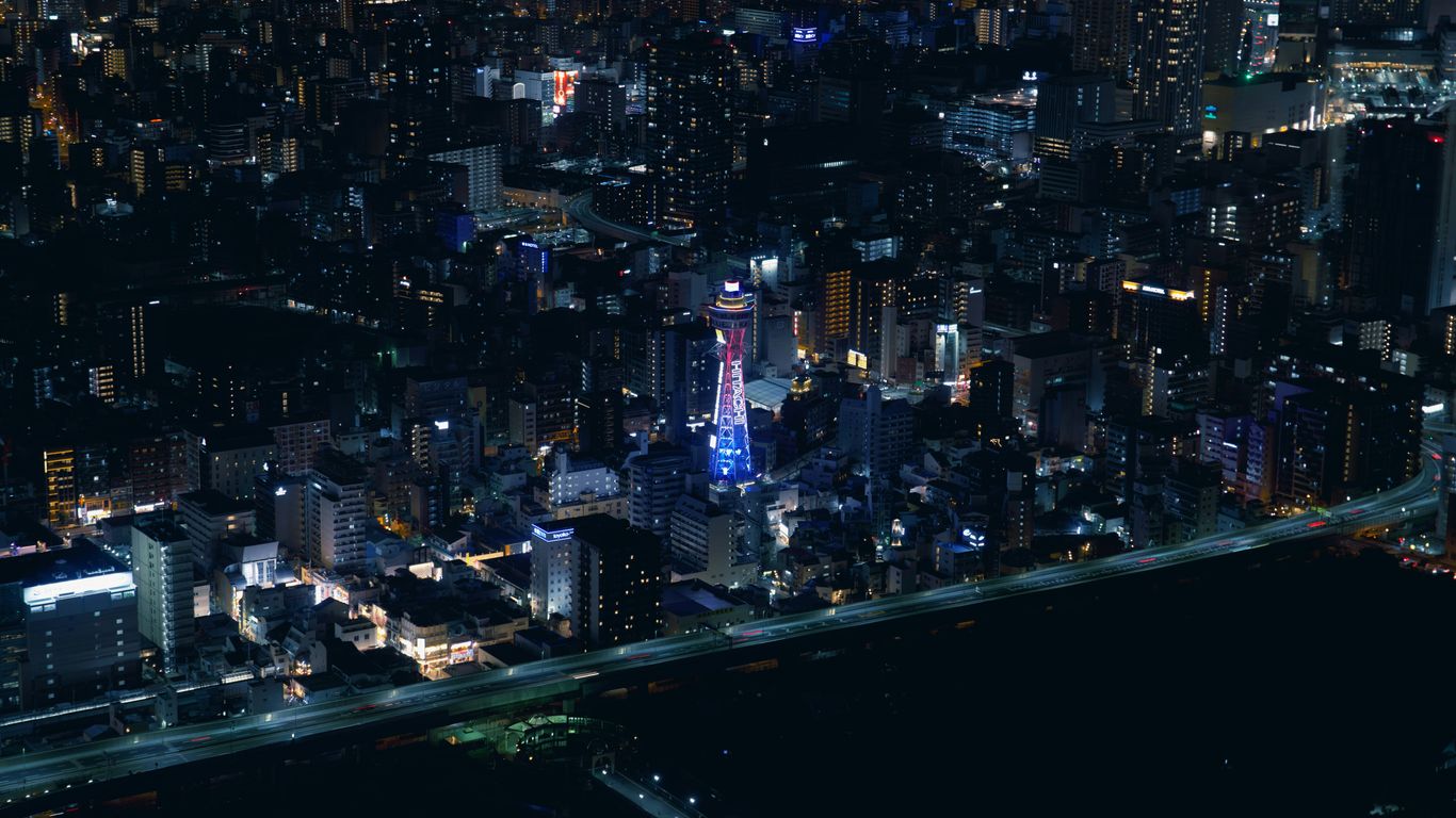 Aerial view of a city skyline at night.
