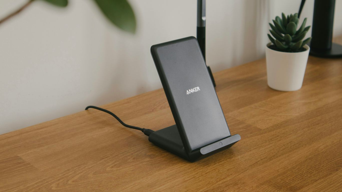 black and gray rectangular device on brown wooden table
