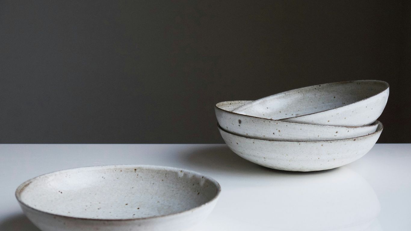 Neutral ceramic dinnerware arranged on table