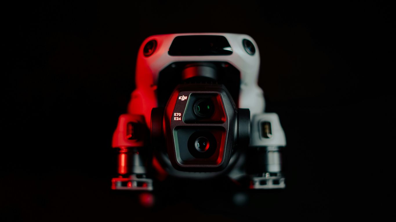 A black and red photo of a camera