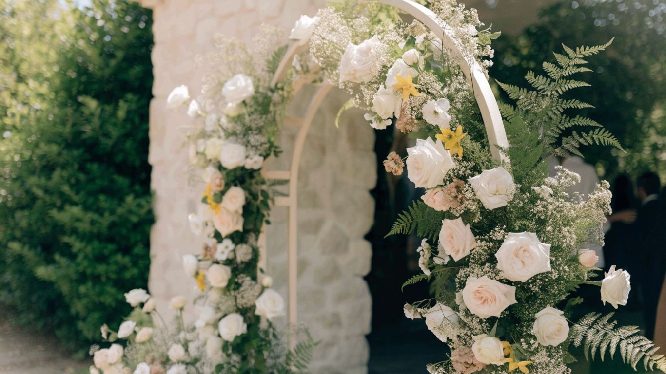 Wedding floral backdrop in a soft garden palette