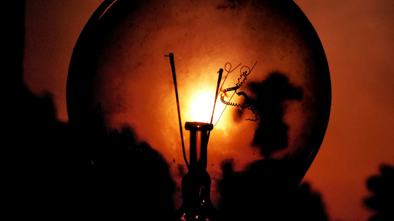 a close up of a street light in the dark