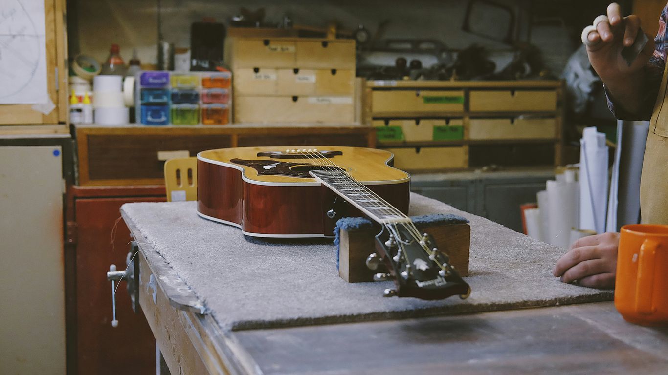 Quality review inside a guitar production facility