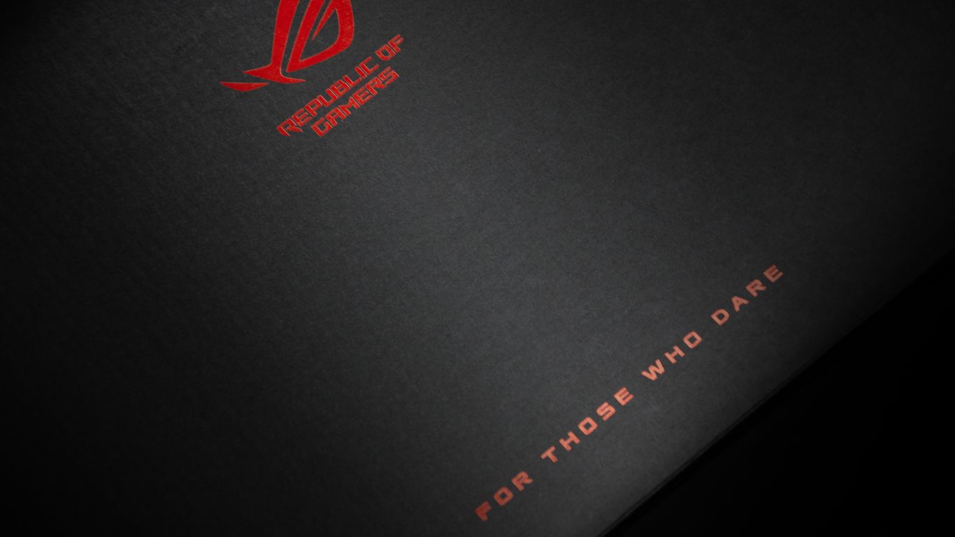 a close up of a book with a red logo on it