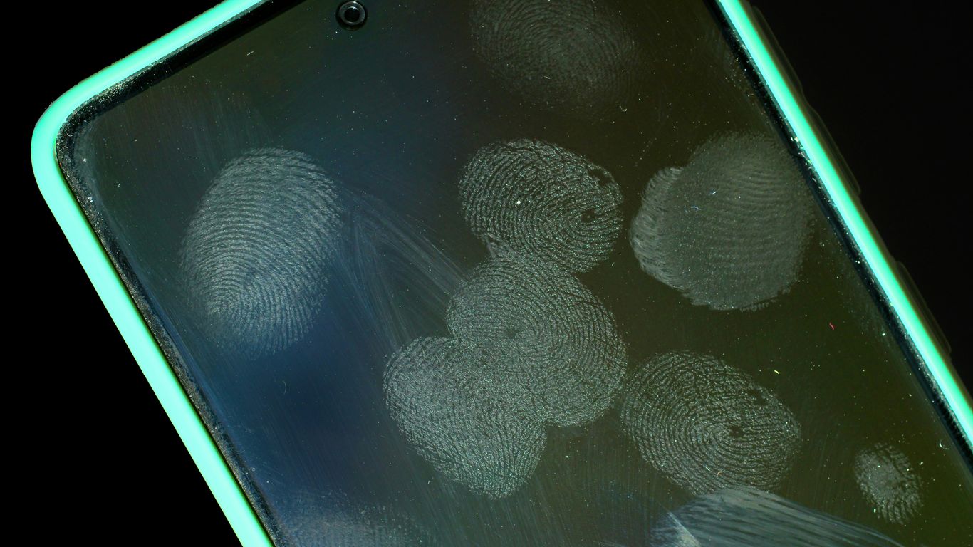 Smudged smartphone screen with fingerprints