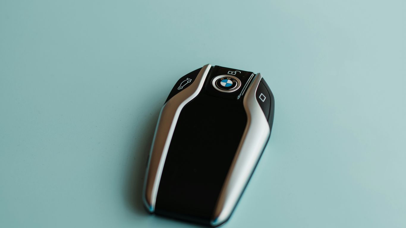 BMW key fob testing beside vehicle