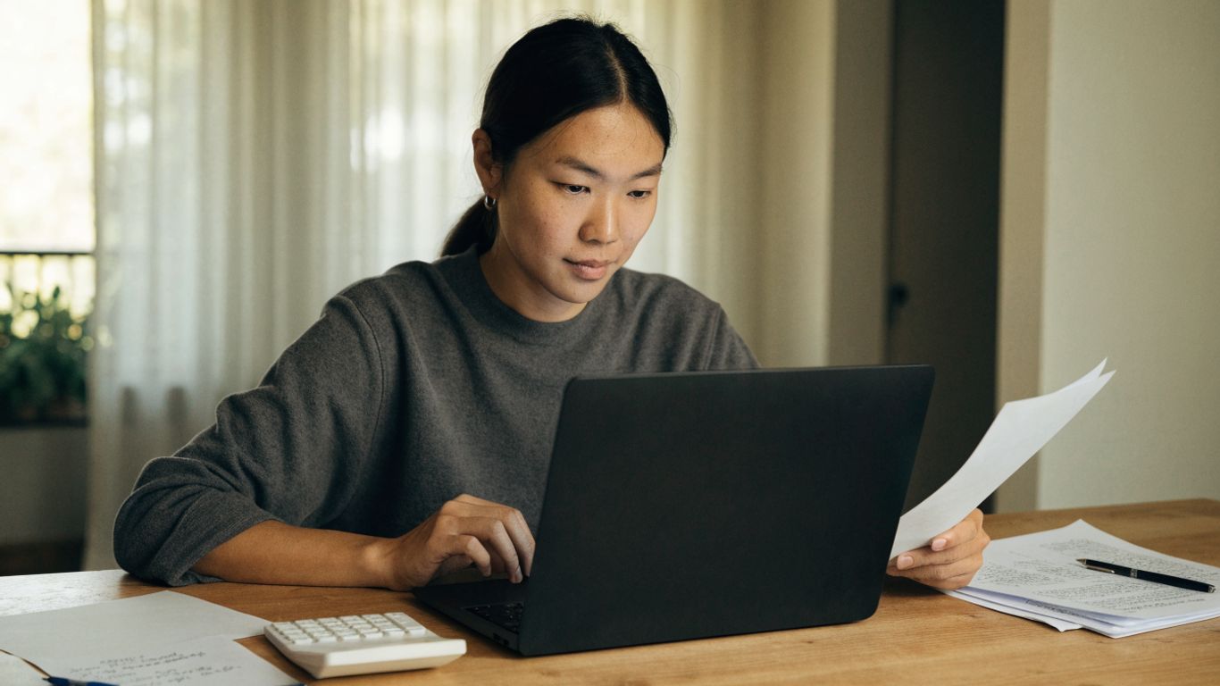 A trader reviewing futures account risk at a desk