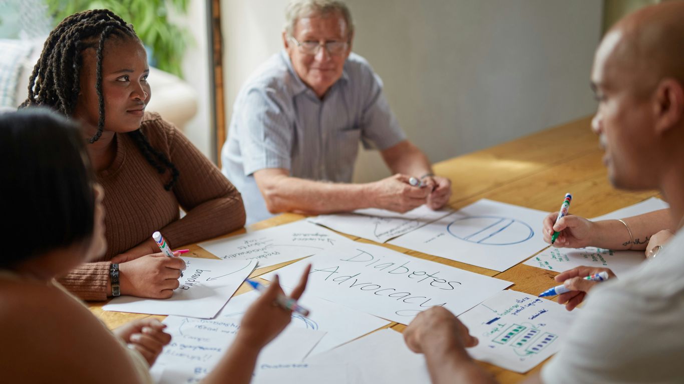 People are working together at a meeting.