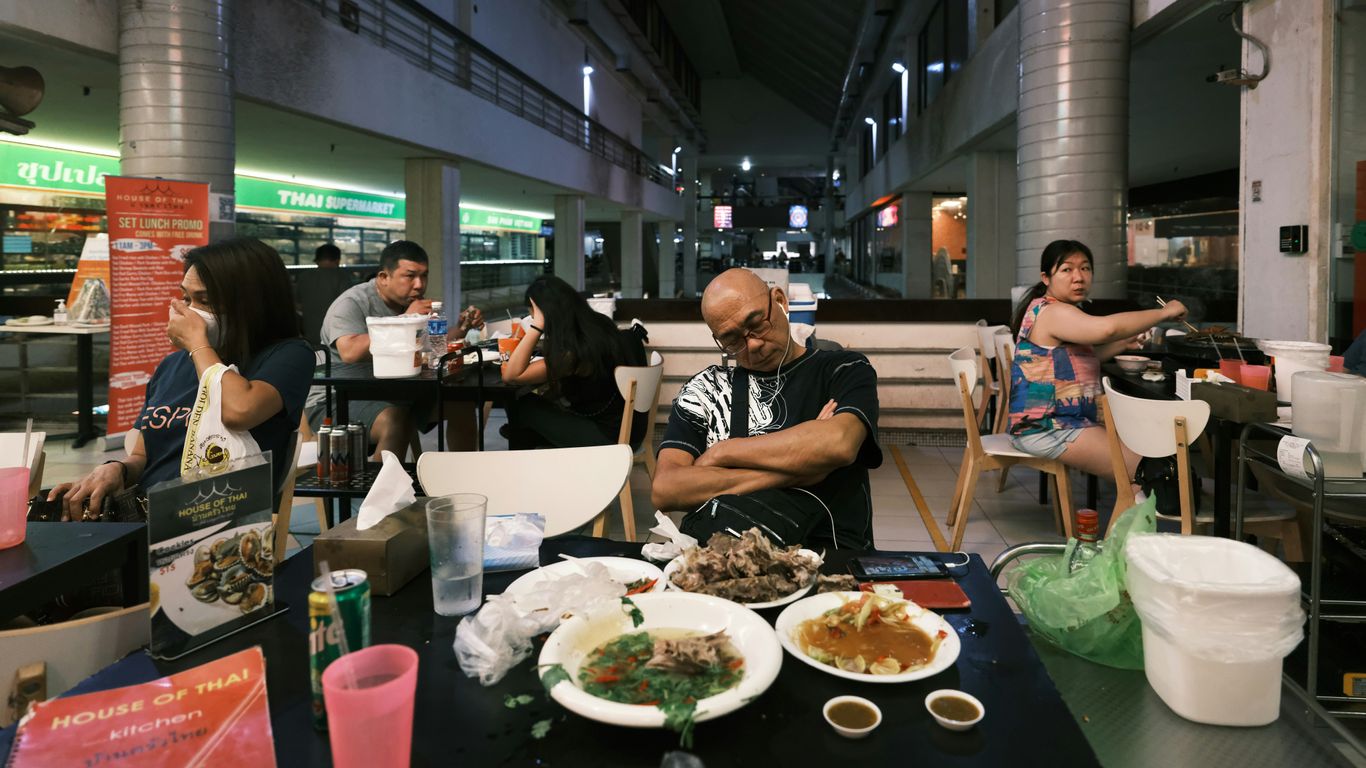 people sitting at the table eating