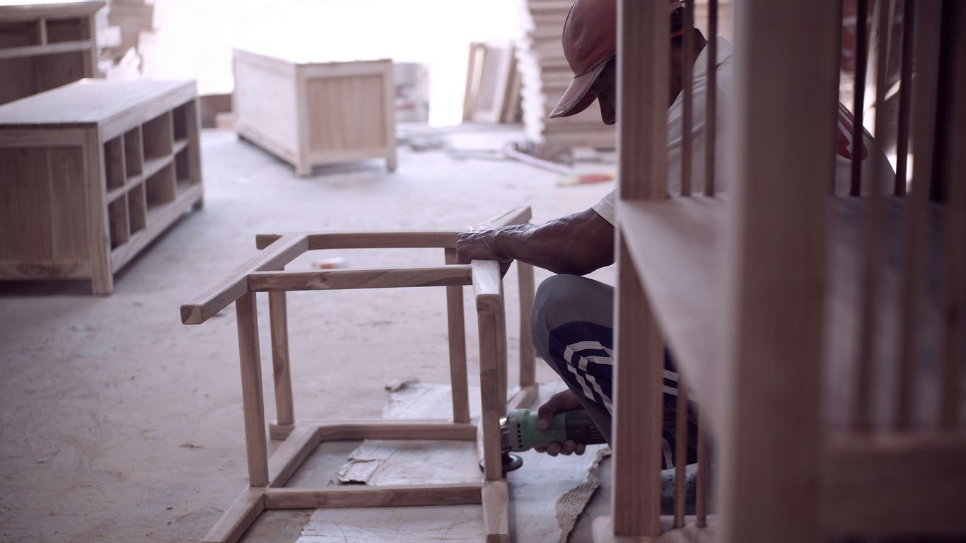 Craftsperson preparing a custom stone furniture top
