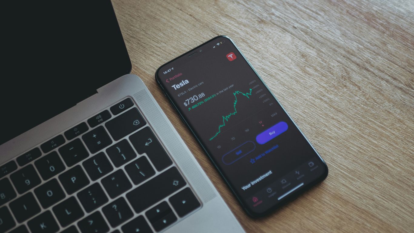 black android smartphone on macbook pro