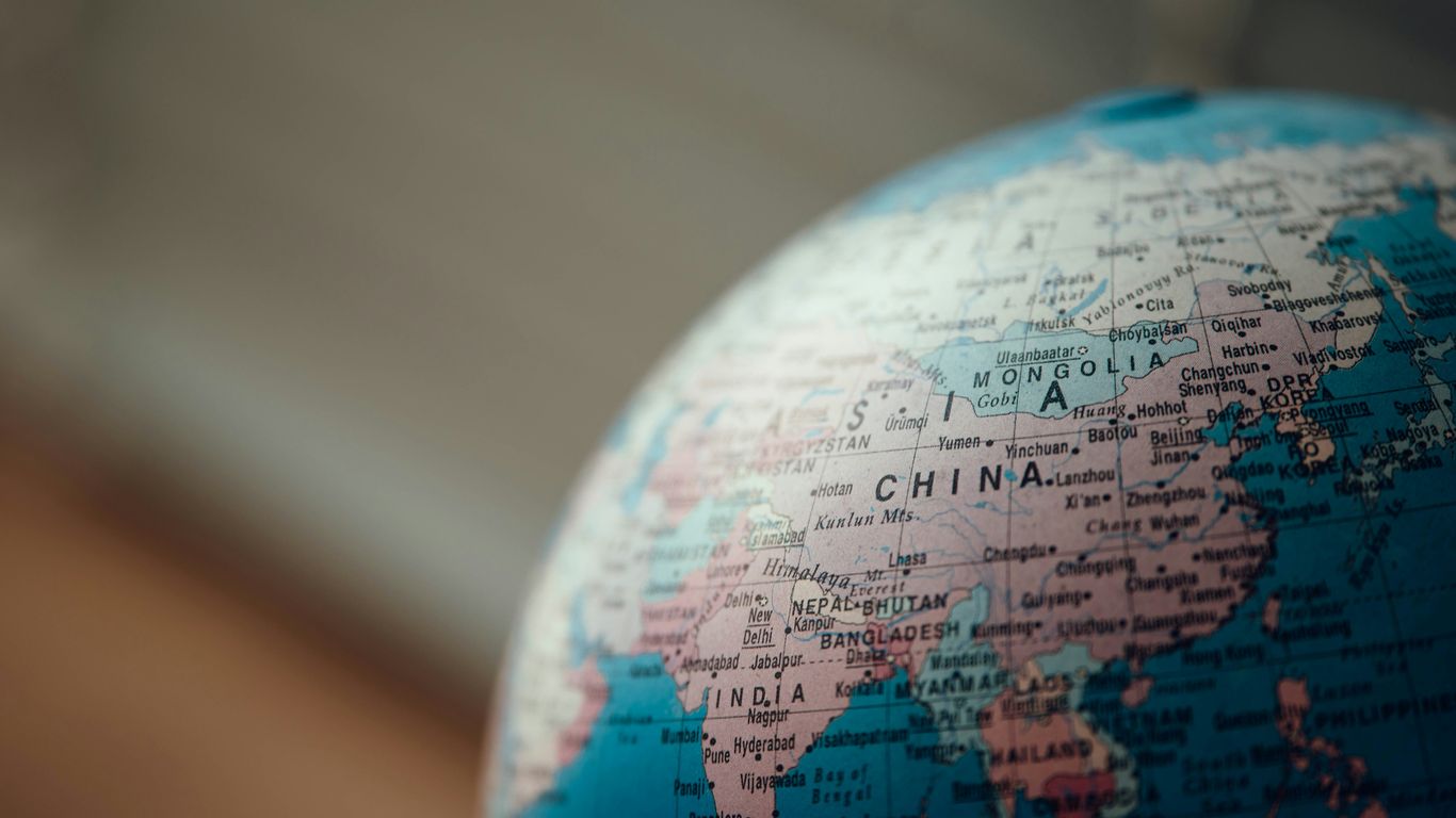 close up photo of blue desk globe