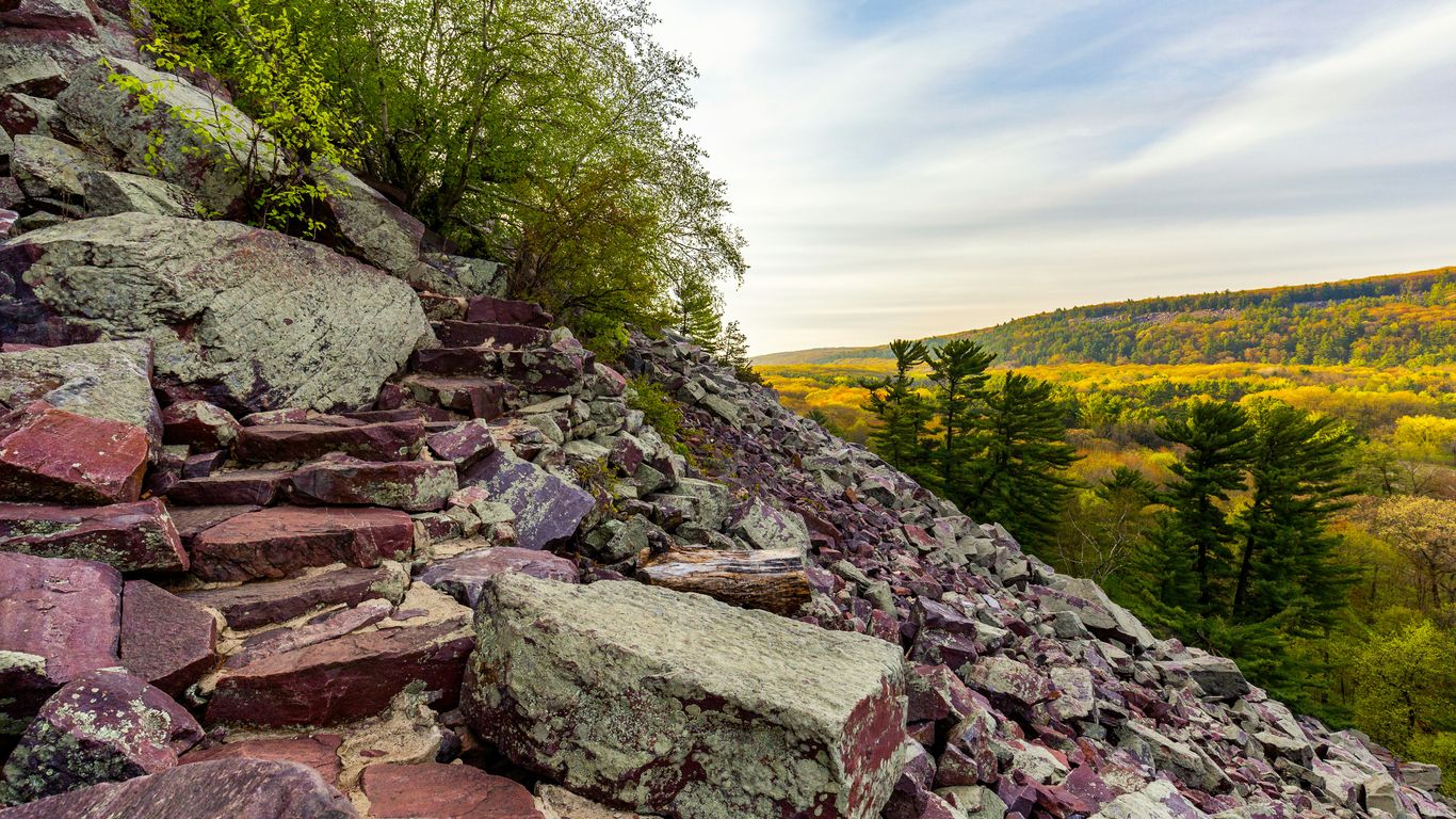 brown rocky trail on slope during daytime