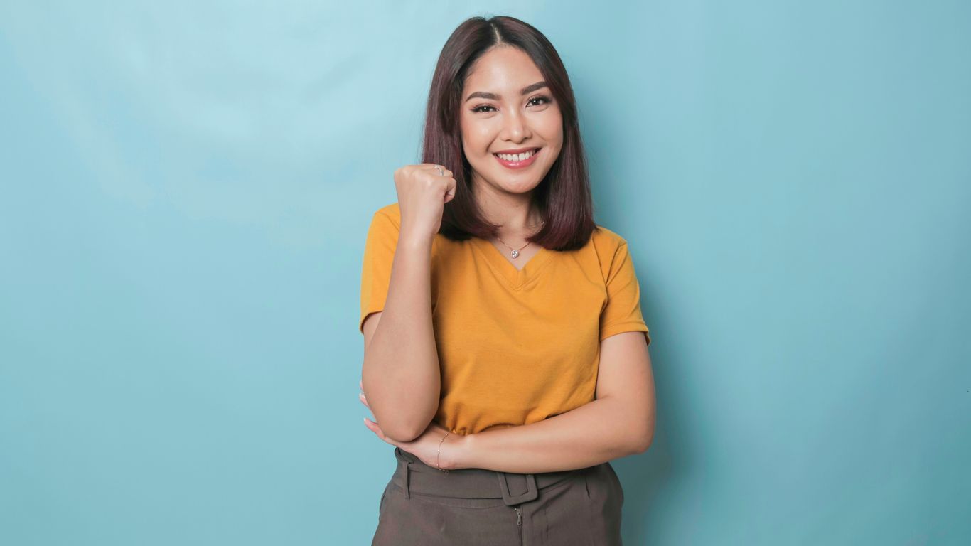 a woman posing for a picture with her arms crossed