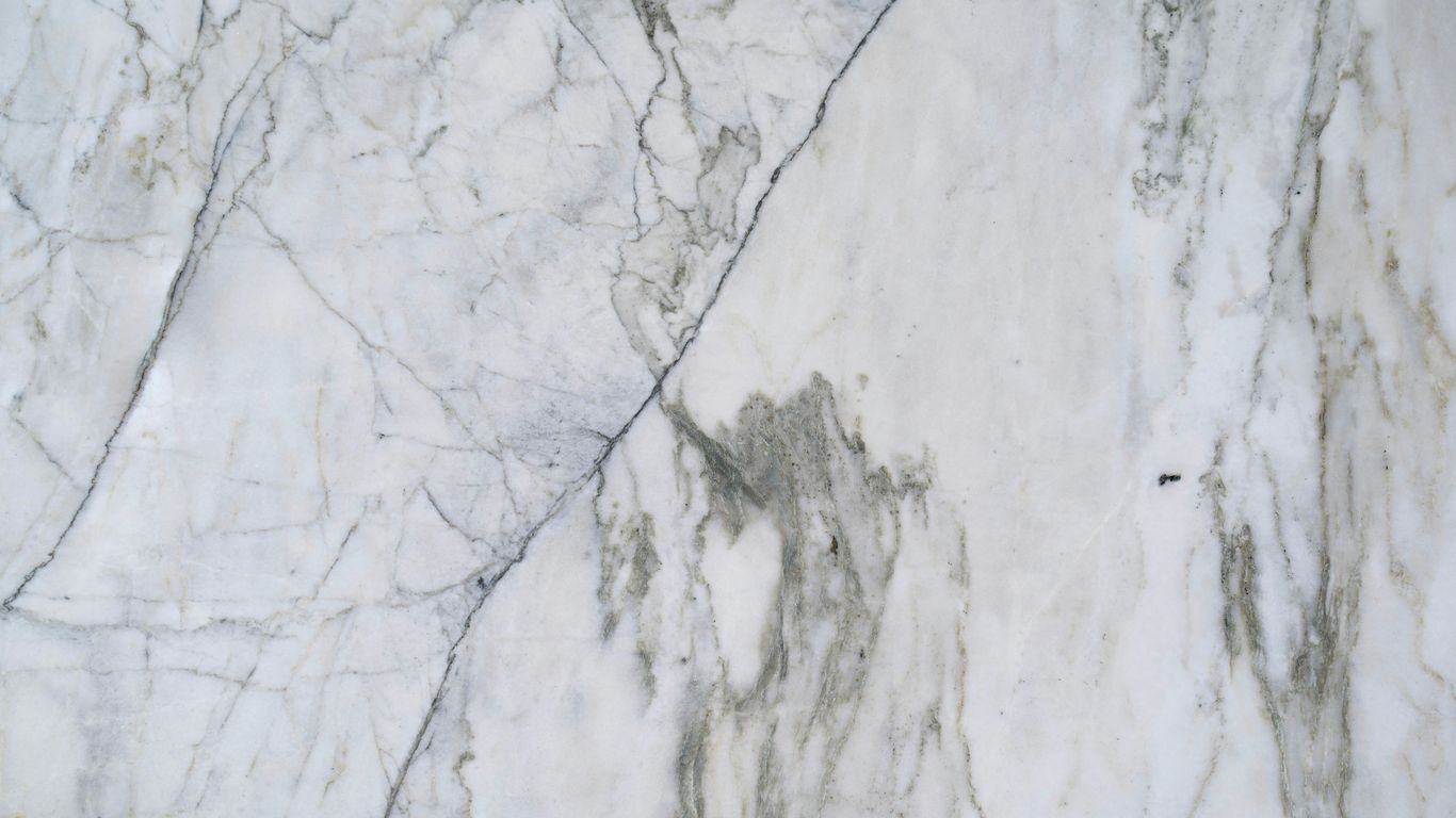 Bookmatched marble wall in a refined interior