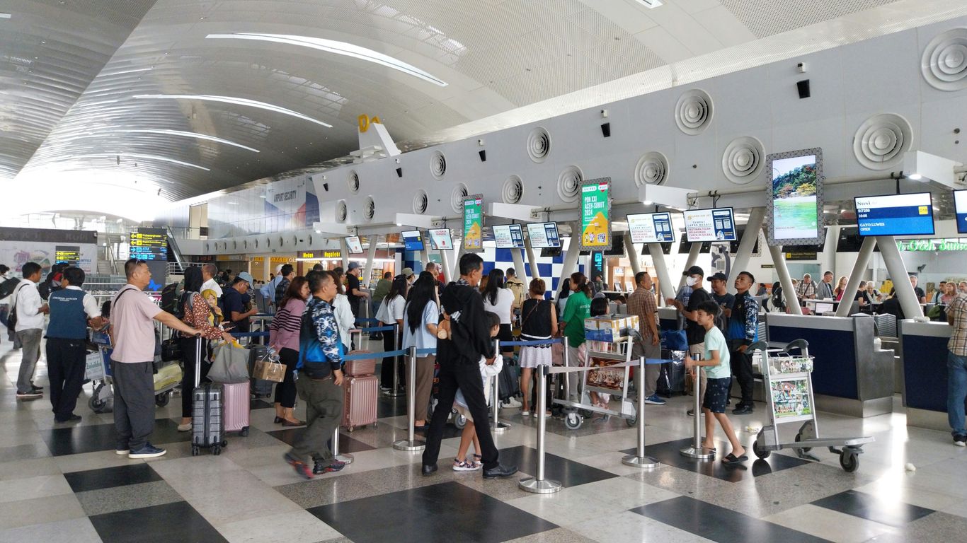 Professional courier checking documents at Airport