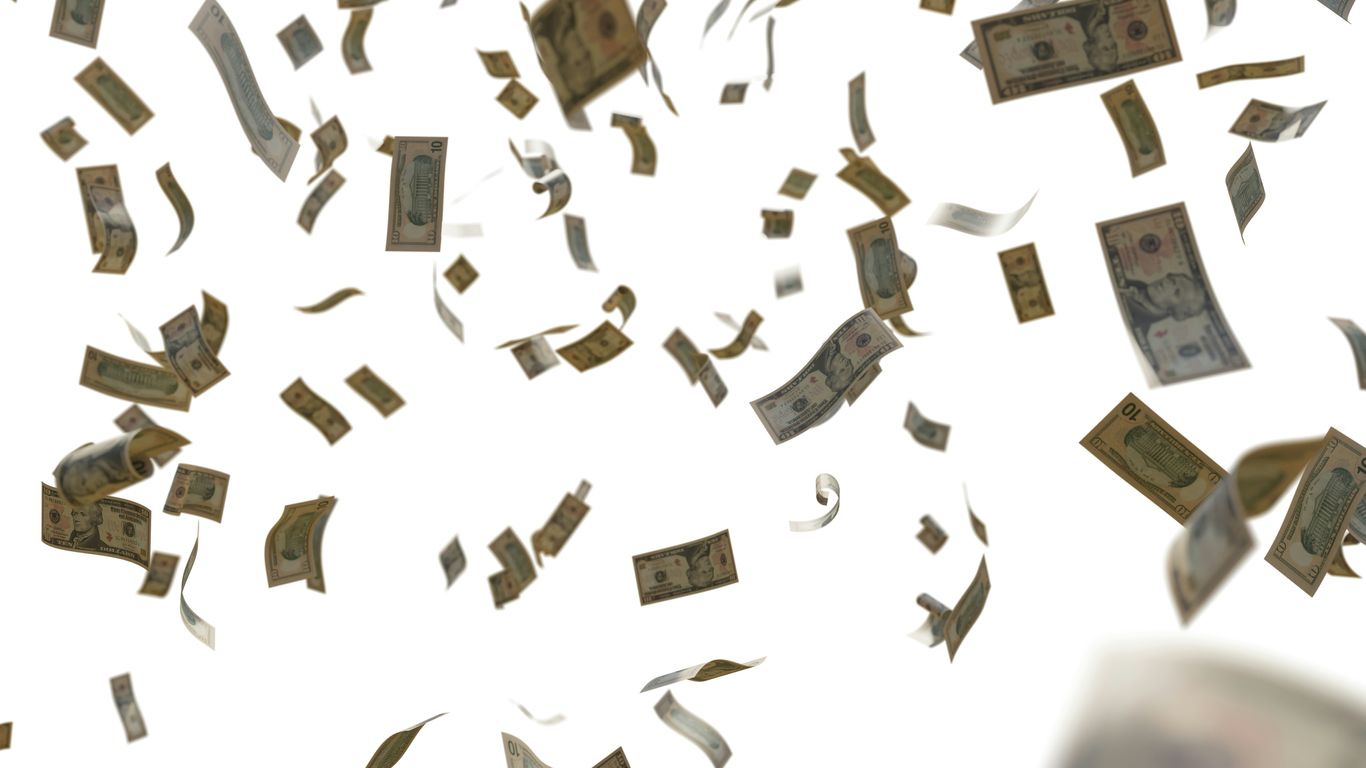 a bunch of money flying through the air
