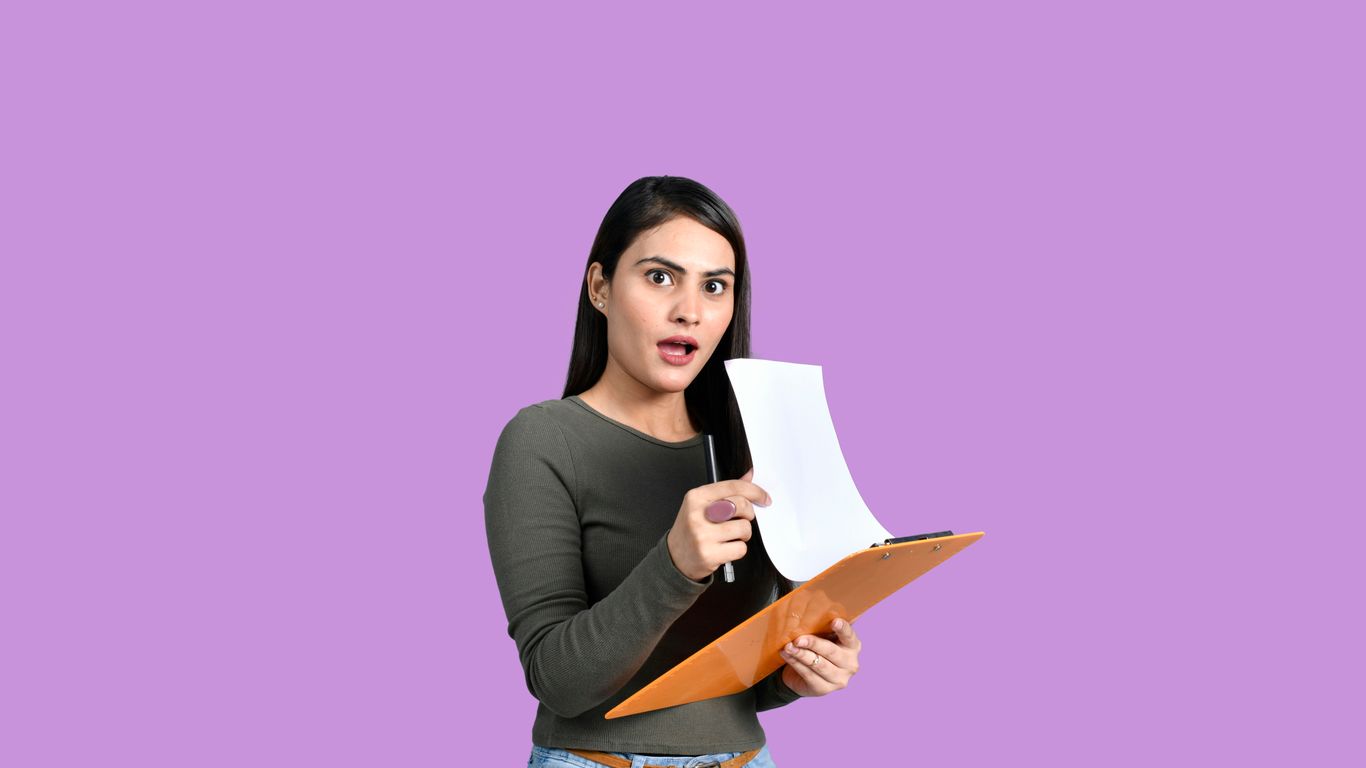 a woman holding a piece of paper