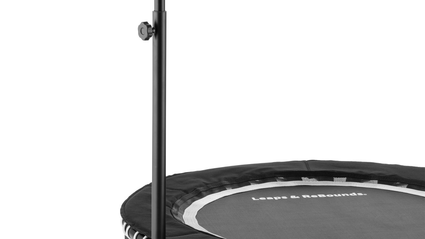 Small exercise trampoline with a handlebar, black and white design.
