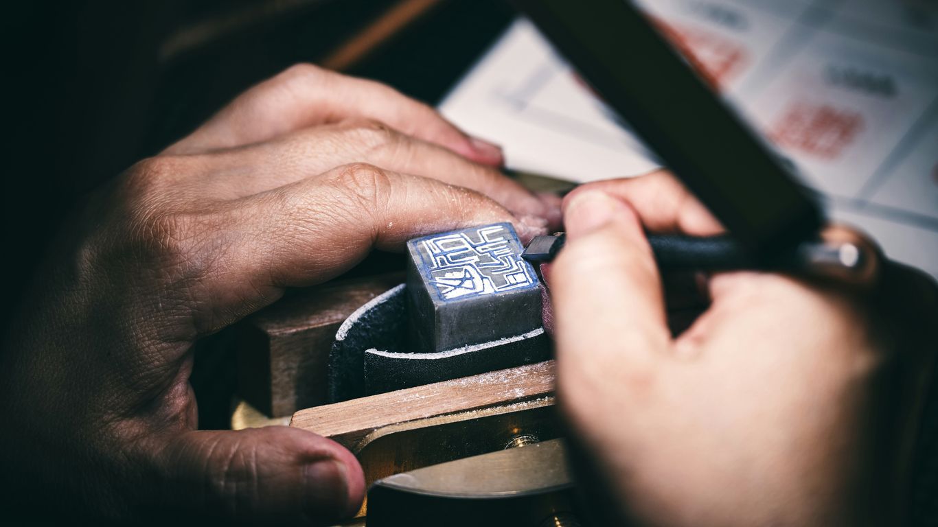 a person is working on a piece of wood