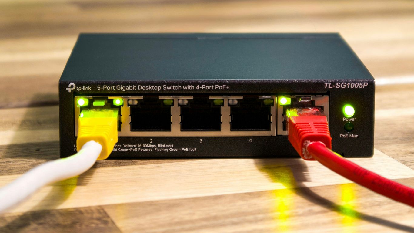 A network switch with ethernet cables connected.