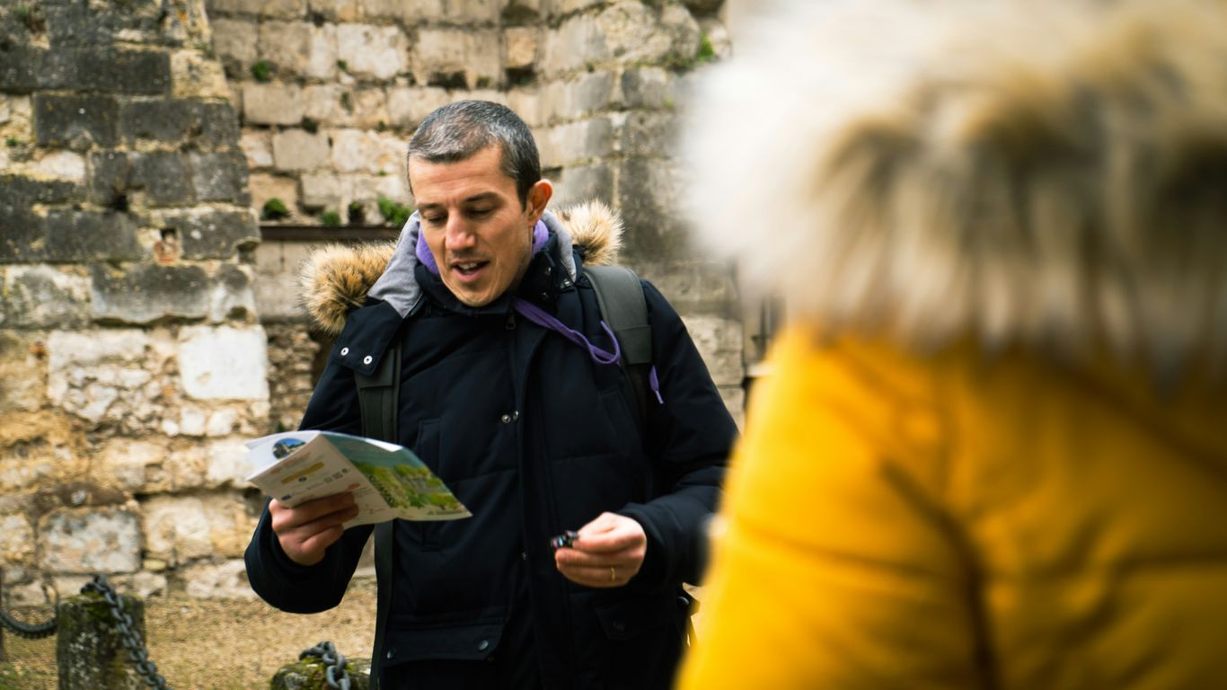A group listening to a guide
