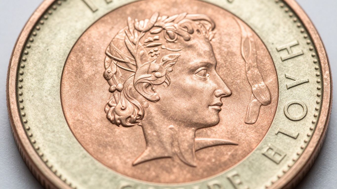 Cross-section of a clad coin showing its layered metal composition.