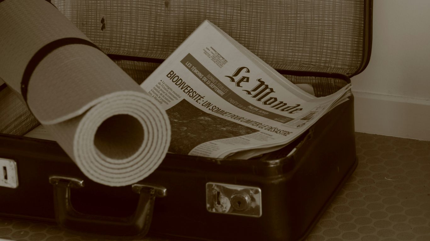 Compact yoga mat packed for travel