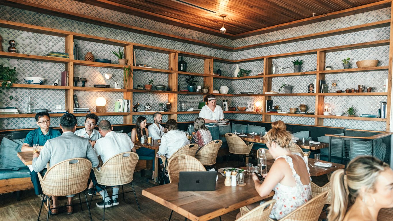 people sitting inside restaurant close-up photography