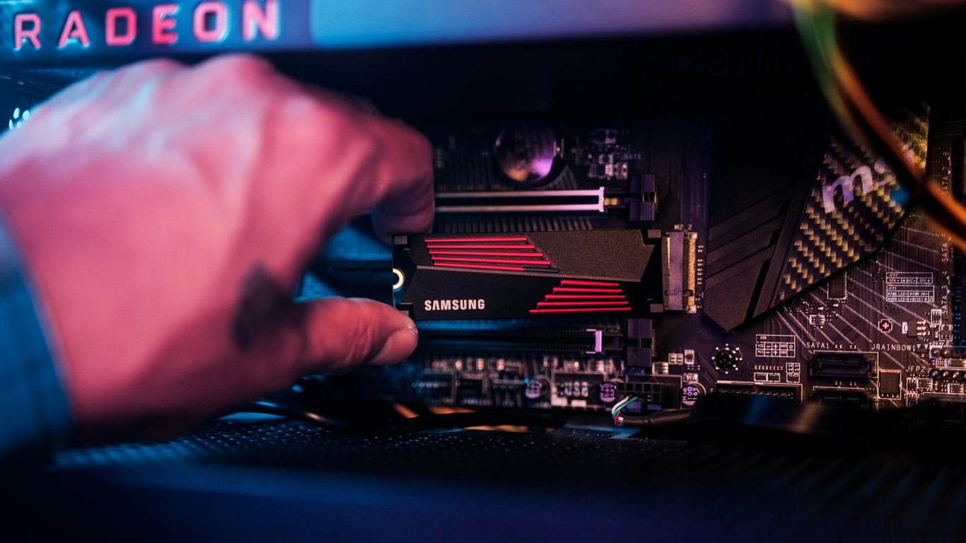 a hand holding a device