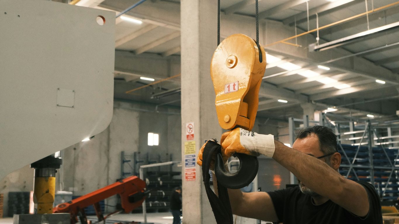 A man working on a machine in a factory