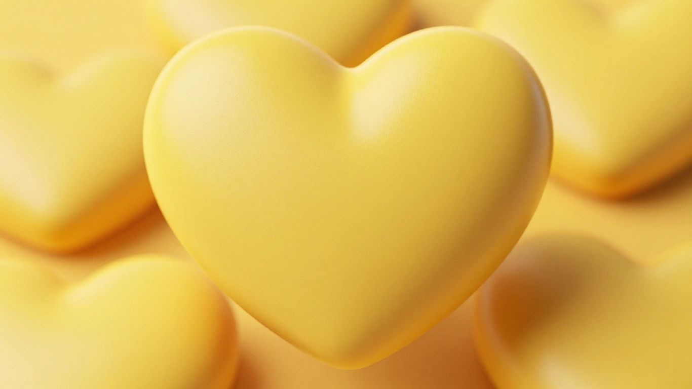 Emoji coeur jaune sur fond blanc