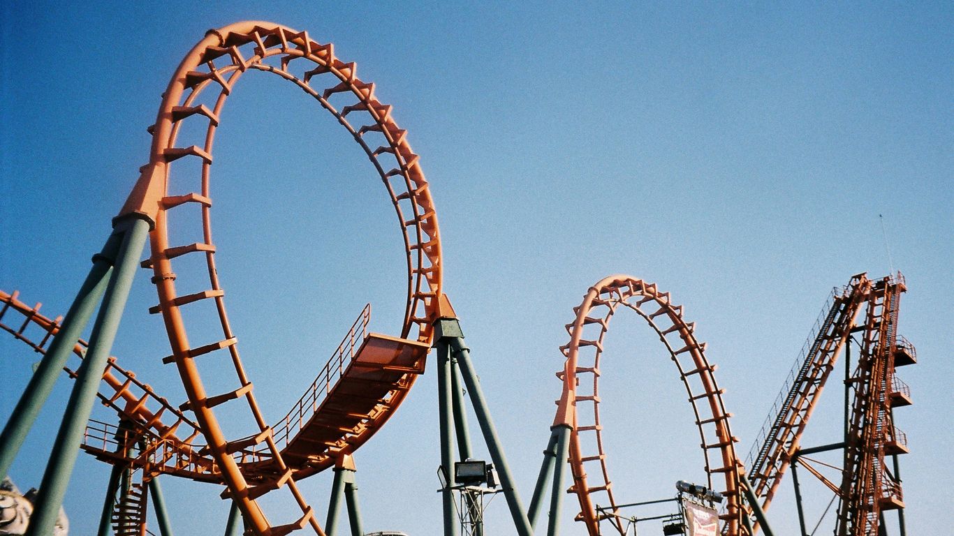 Children riding a roller coaster