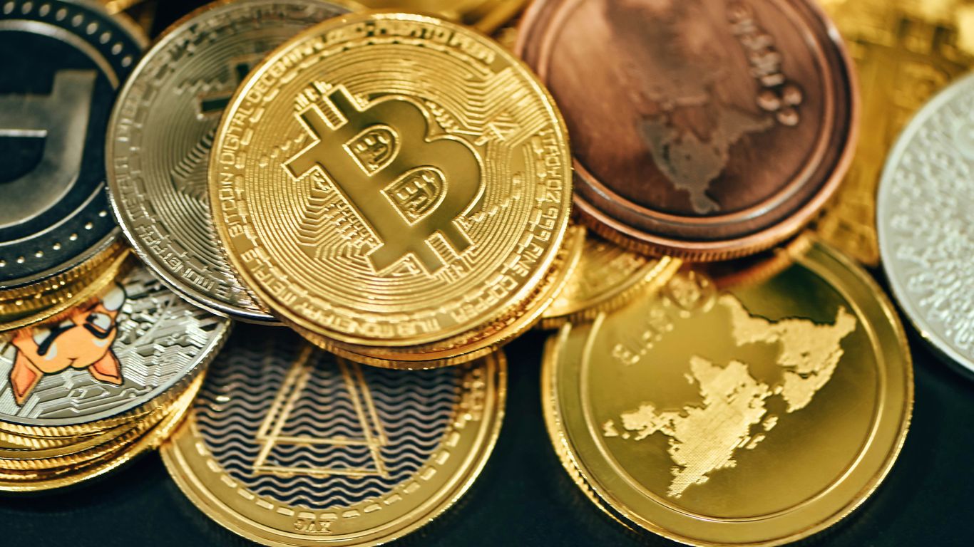 a pile of gold and silver bitcoins