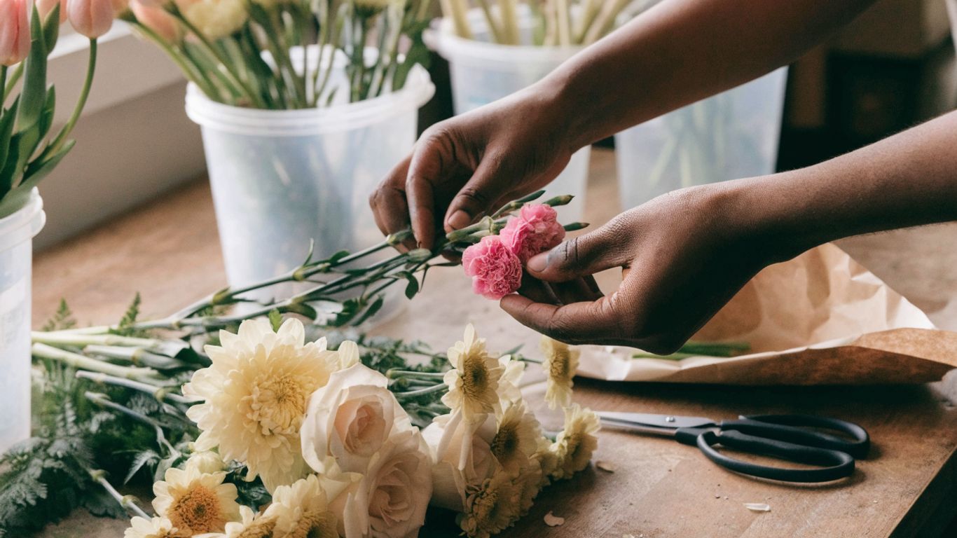 Florist arranging fresh flowers for local delivery