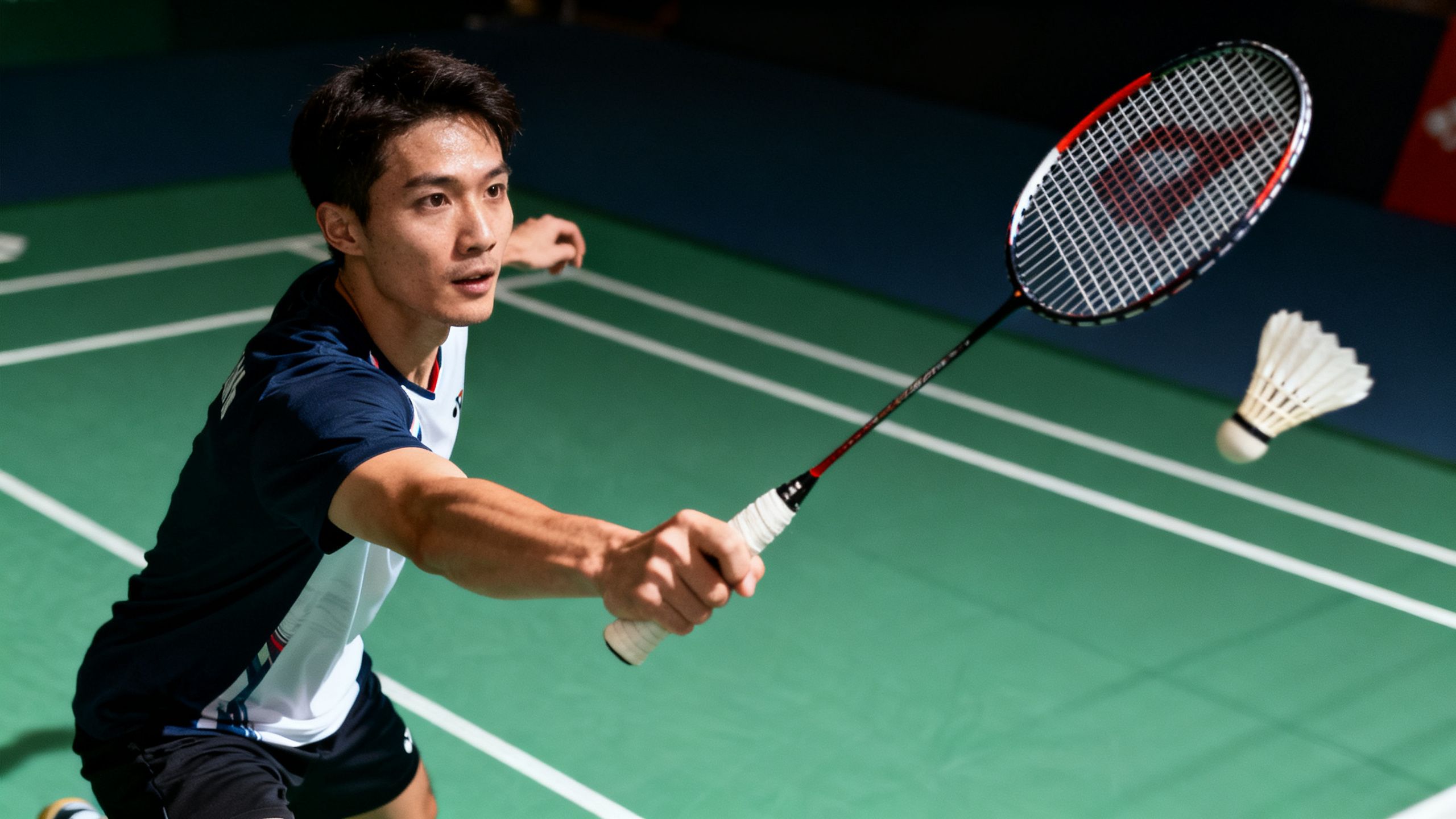 Badminton player demonstrating a correct forehand racket grip.