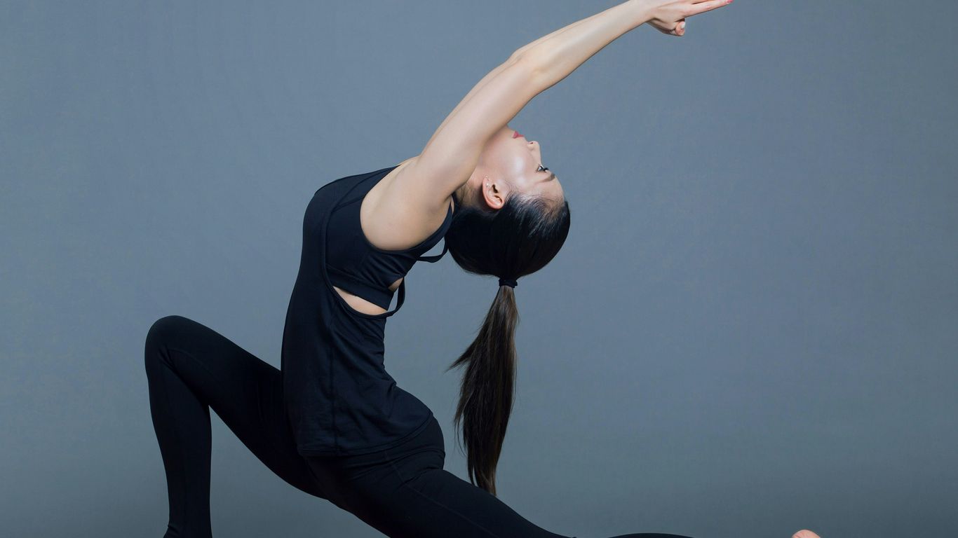 A person stretching in comfortable activewear
