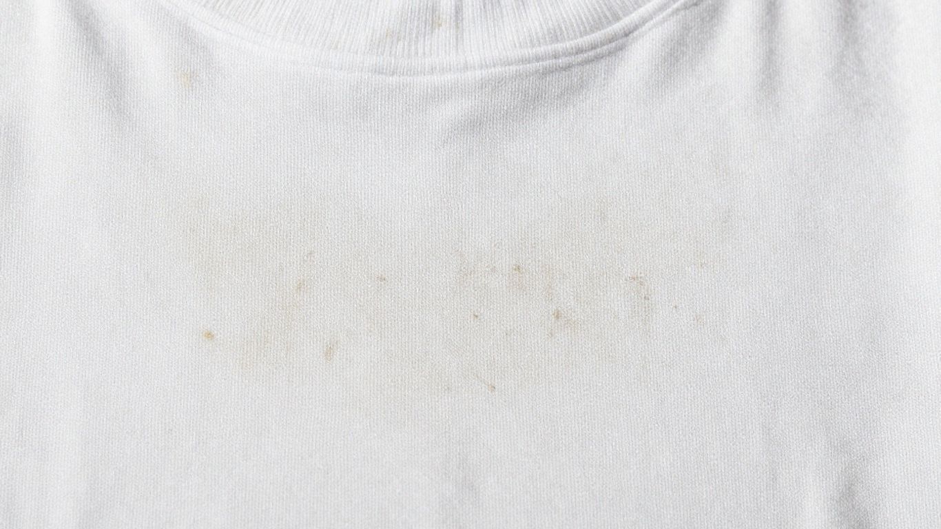 Fabric with visible detergent residue buildup.