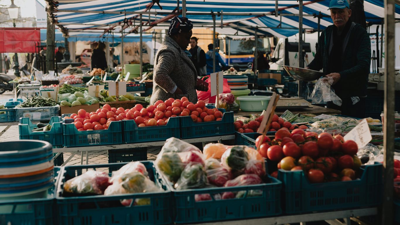 red and white fruit display on market