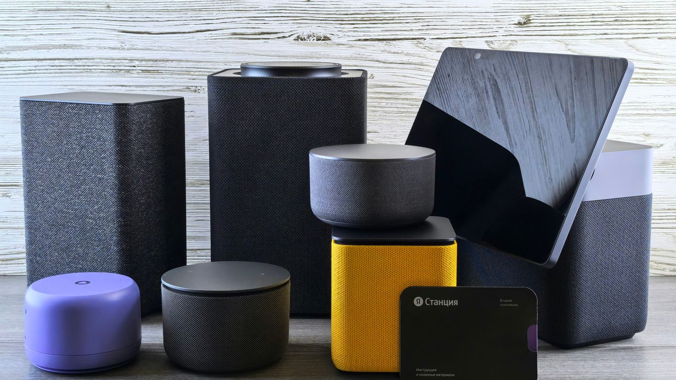 Collection of modern electronic devices and speakers.