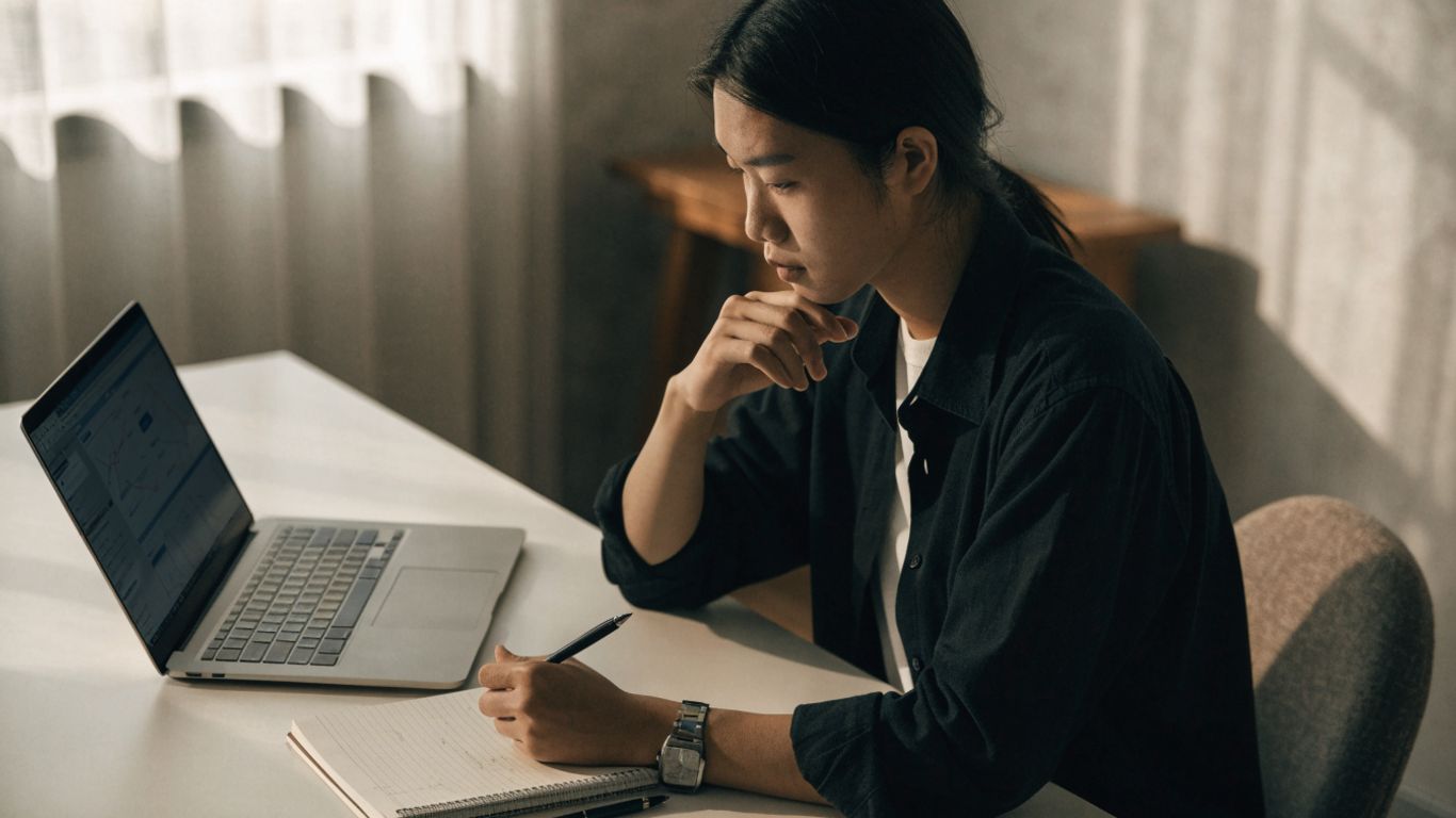 Futures trader reviewing a simulated account at desk