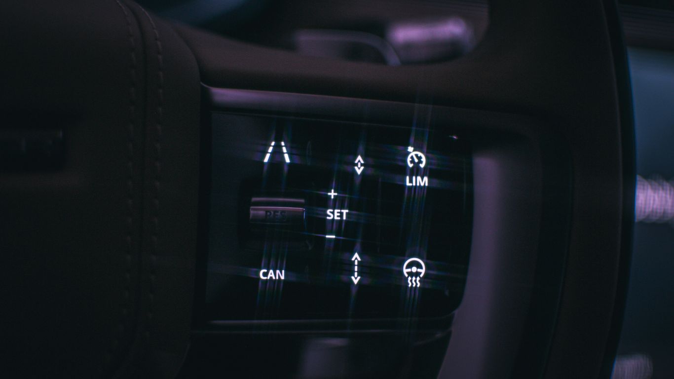 a close up of a car dashboard with buttons