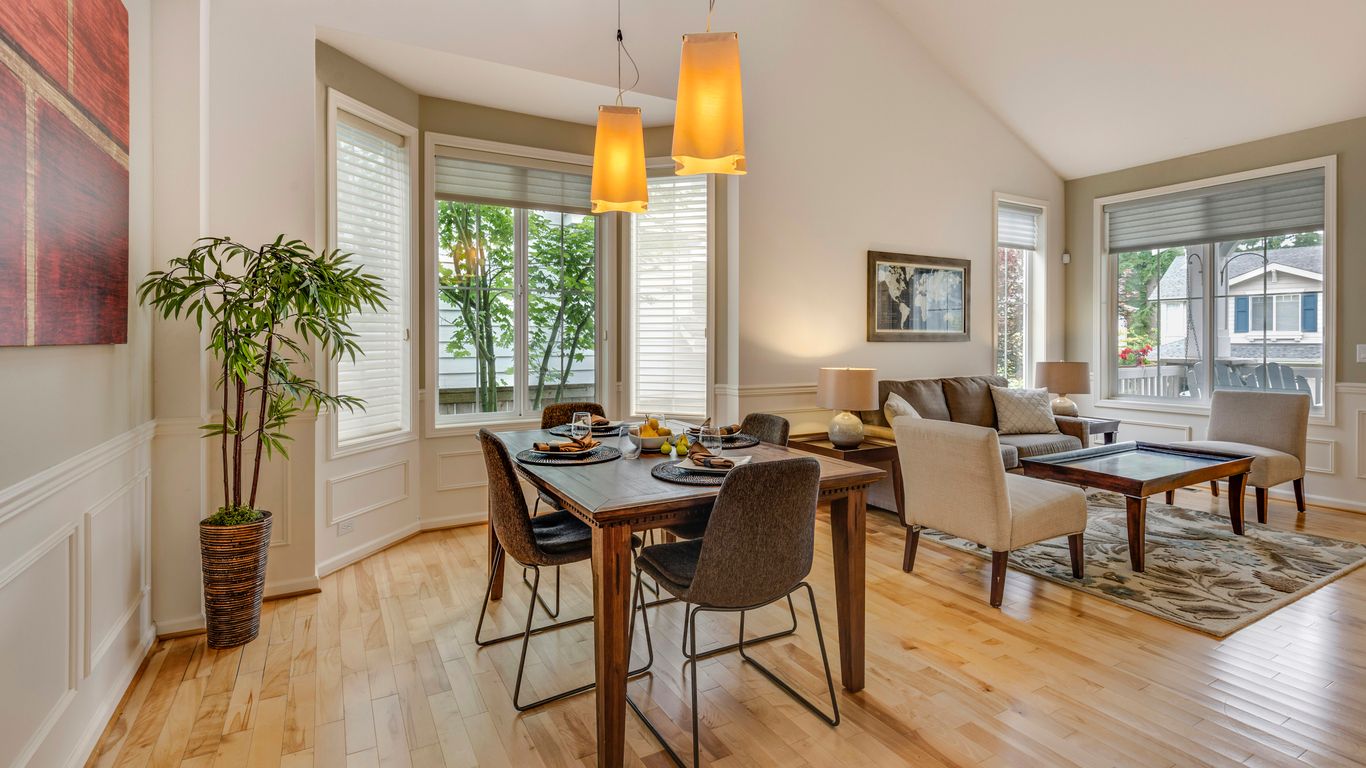 Measuring a dining room with tape
