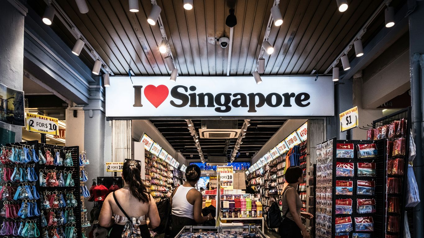 a group of people standing inside of a store