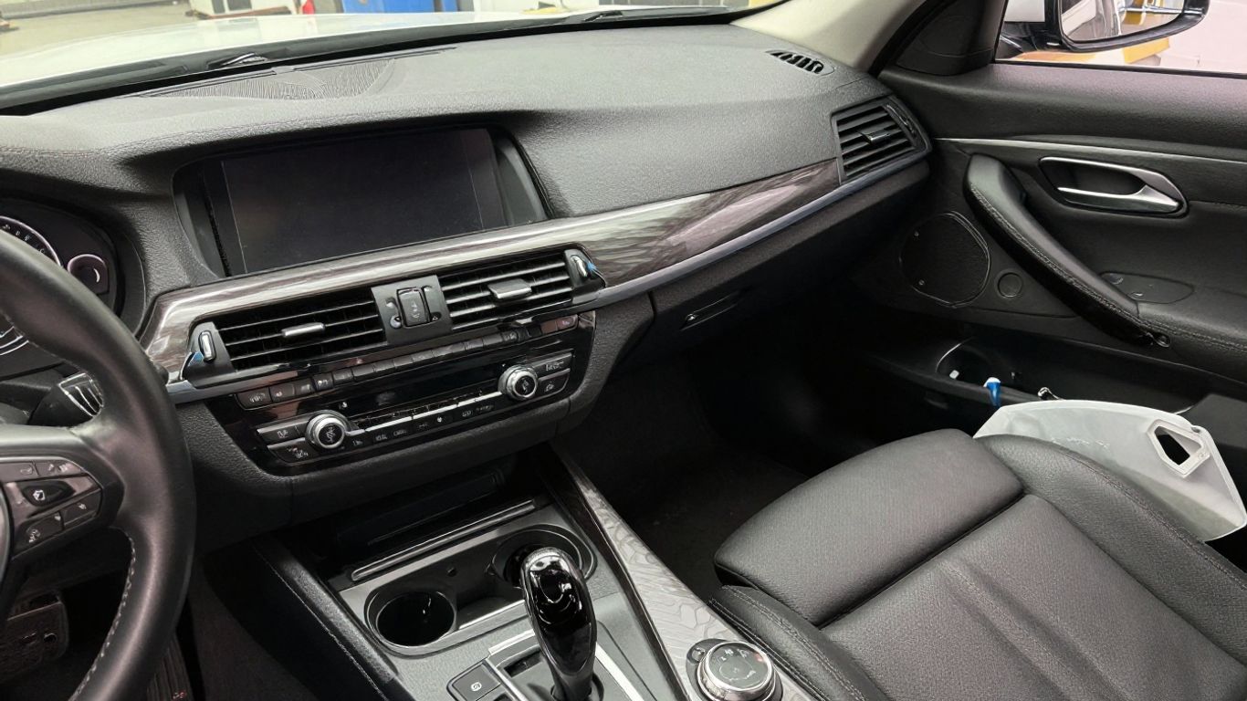 BMW dashboard parts matched beside vehicle interior